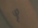 Located on Giles' inner left arm just above the elbow. Ethan Rayne and Buffy Summers both had the same tattoo removed.